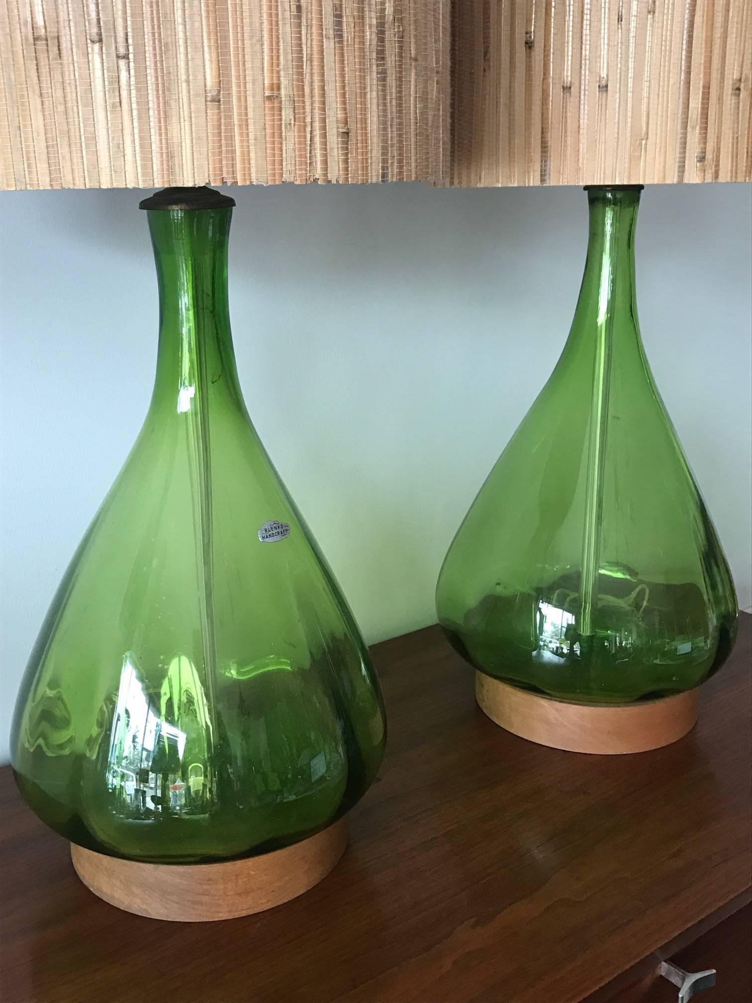 A pair of interesting glass lamps by Blenko. Original wood bases and a label on one lamp, vintage, circa 1960s.