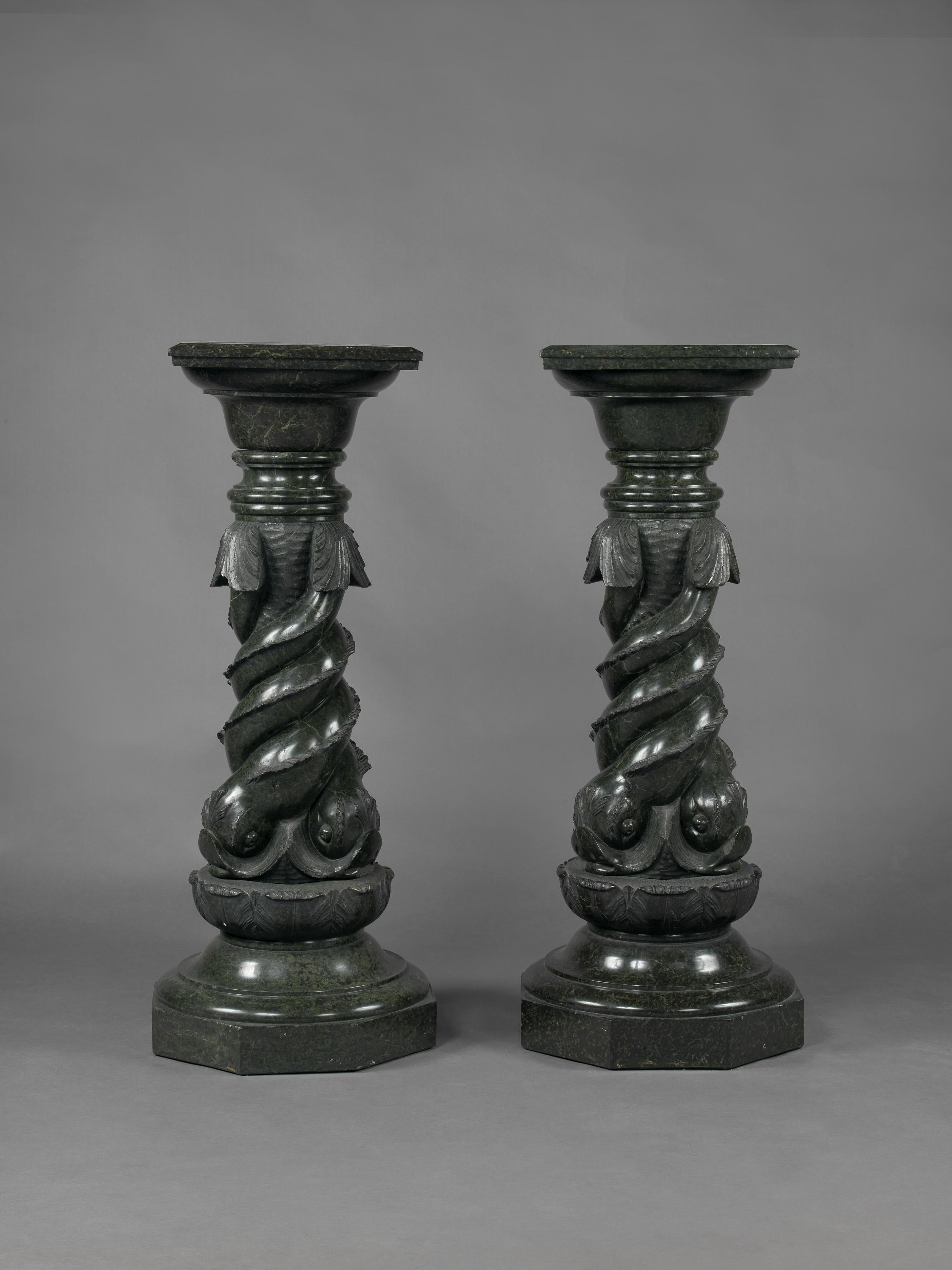A pair of unusual green serpentine marble pedestals, carved with entwined dolphins.

Italian, circa 1880. 

This unusual pair of serpentine marble pedestals have square section tops above columns carved with expressive entwined dolphins, raised