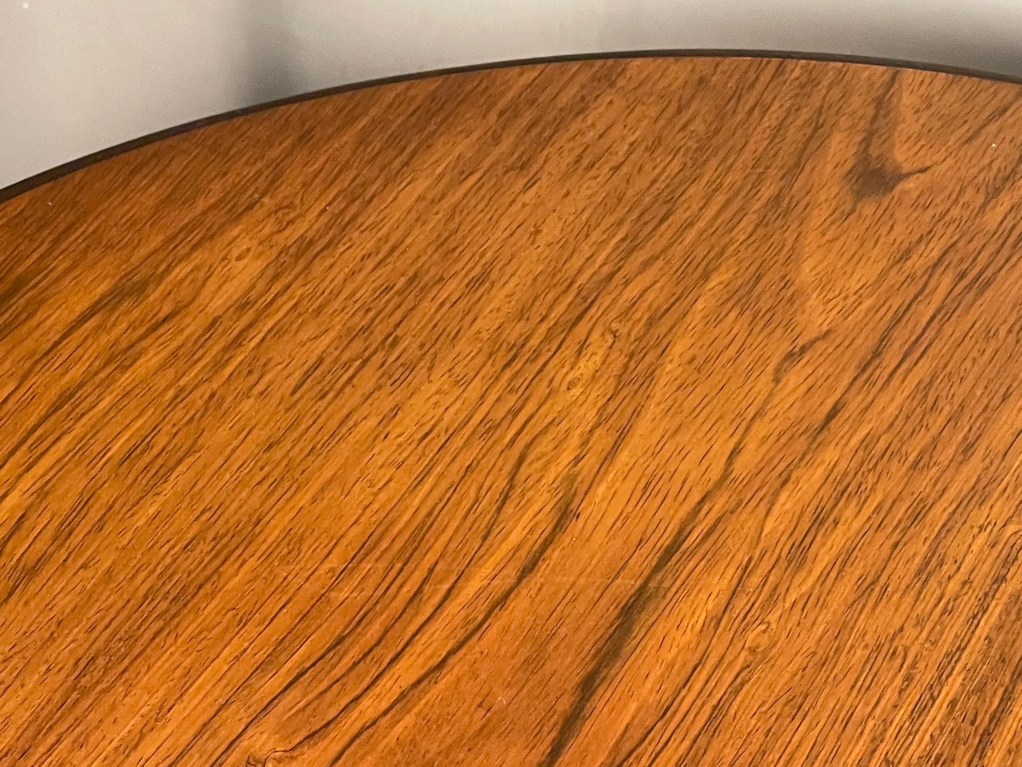 A pair of unusual tables by Dunbar ca' 1970's. Large scale-perfect as end tables or lamp tables, walnut tops, legs have a stuctural cut out detail.