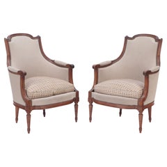 Pair of Upholstered Louis XVI Style Walnut Bergeres, circa 1940