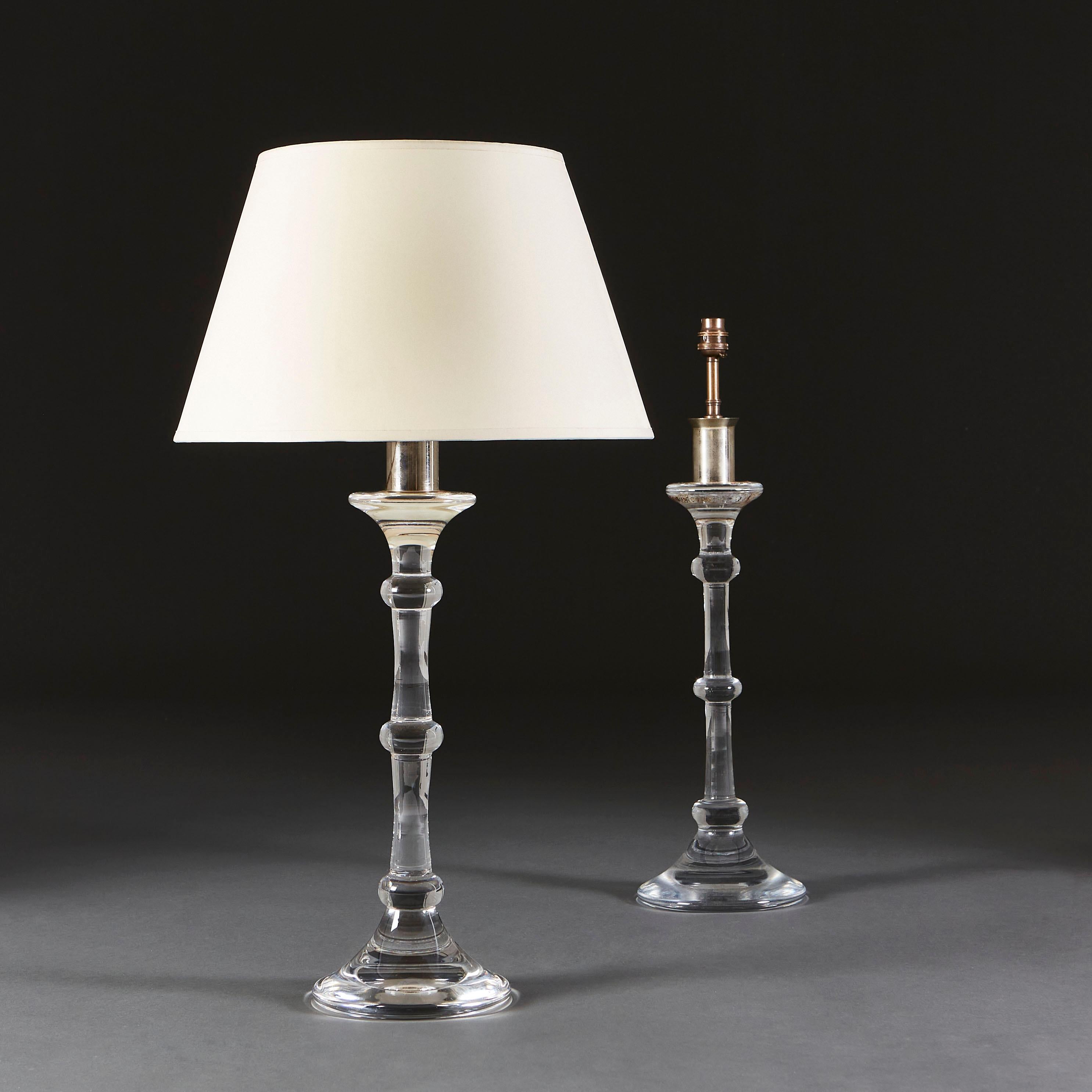 A pair of Val Saint Lambert clear glass column lamps, the stem divided by three bands, with a flared neck and base.

Currently wired for the UK. Please enquire for rewiring services.

Please note: Lampshades not included.