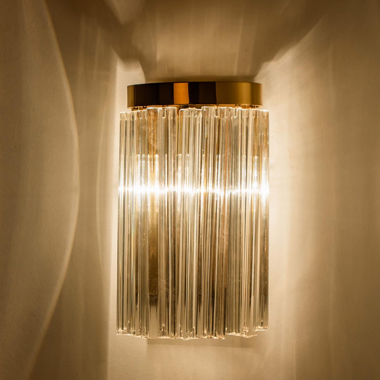 Beautiful wall light featuring multiple long crystal clear glass 