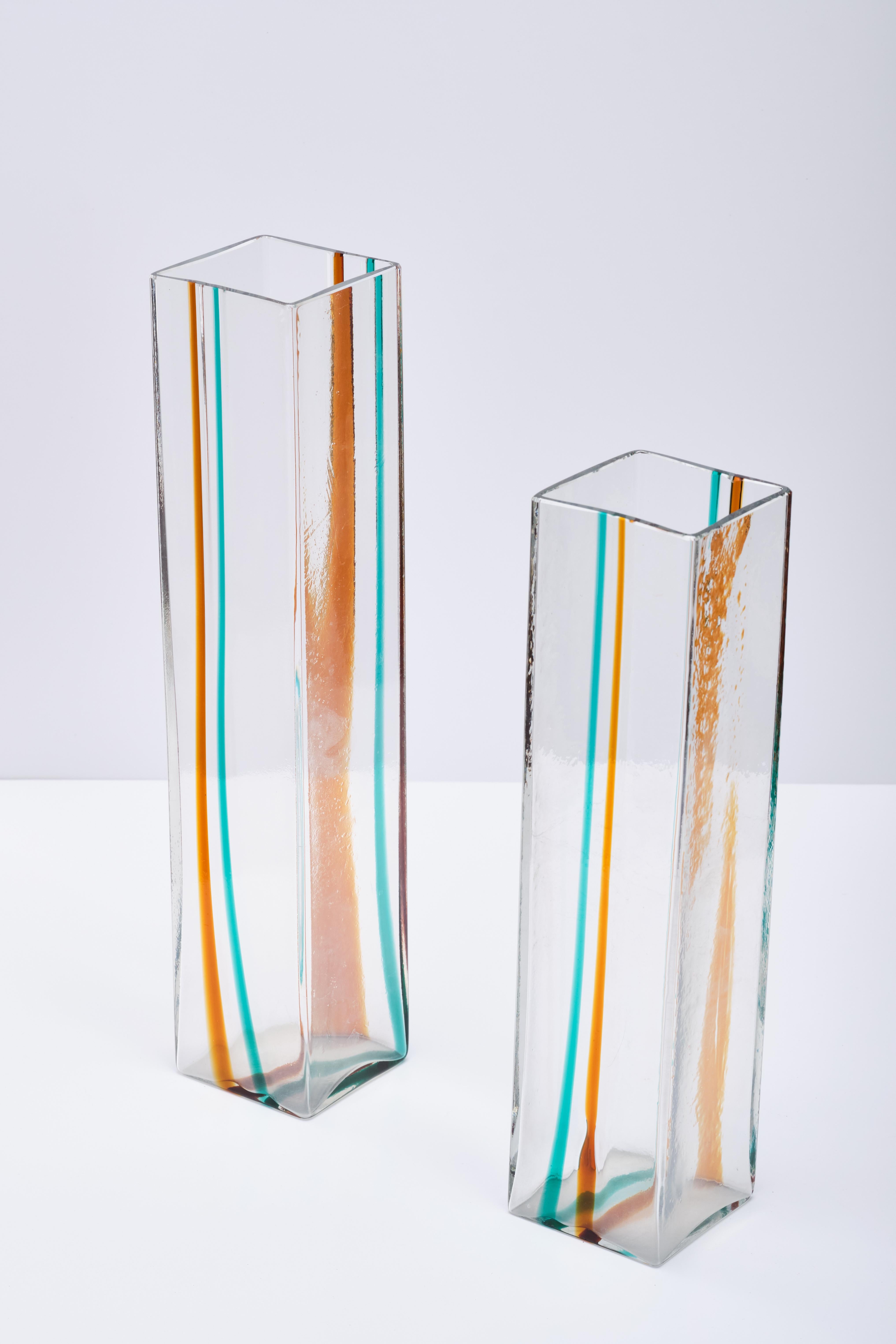 Two Venini vases mold blown glass with decoration on the band in colored glass. Signed in Venini Italia acid. Produced by Venini, Italy, around 1970. 
Rare Laura de Santillana for Venini blown glass designed in the 1970s, signed Venini.  This