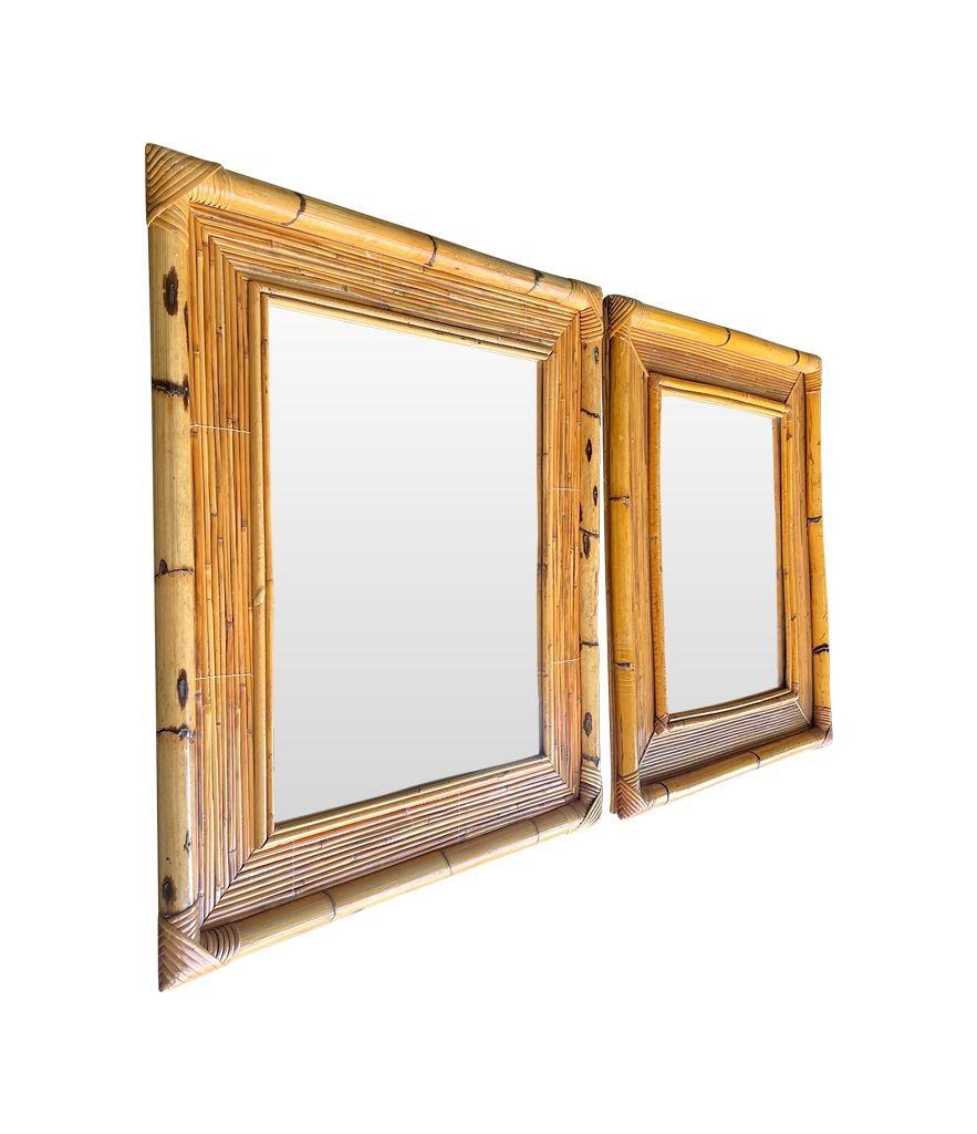 A pair of 1970s Italian bamboo mirrors with bamboo frames. Very slight difference in the internal frame design, otherwise exactly the same size. Both with orignal plates and solid wood backs and would make a lovely pair of bathroom mirrors