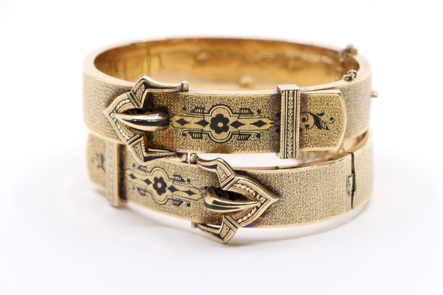 A Pair of Victorian 14K Gold Enamel Belt Bangle Bracelect

Approximate Dimensions:
16.4 cm (circumference) 
1.4 cm - 2 cm (Width) 
46.3 grams in weight.