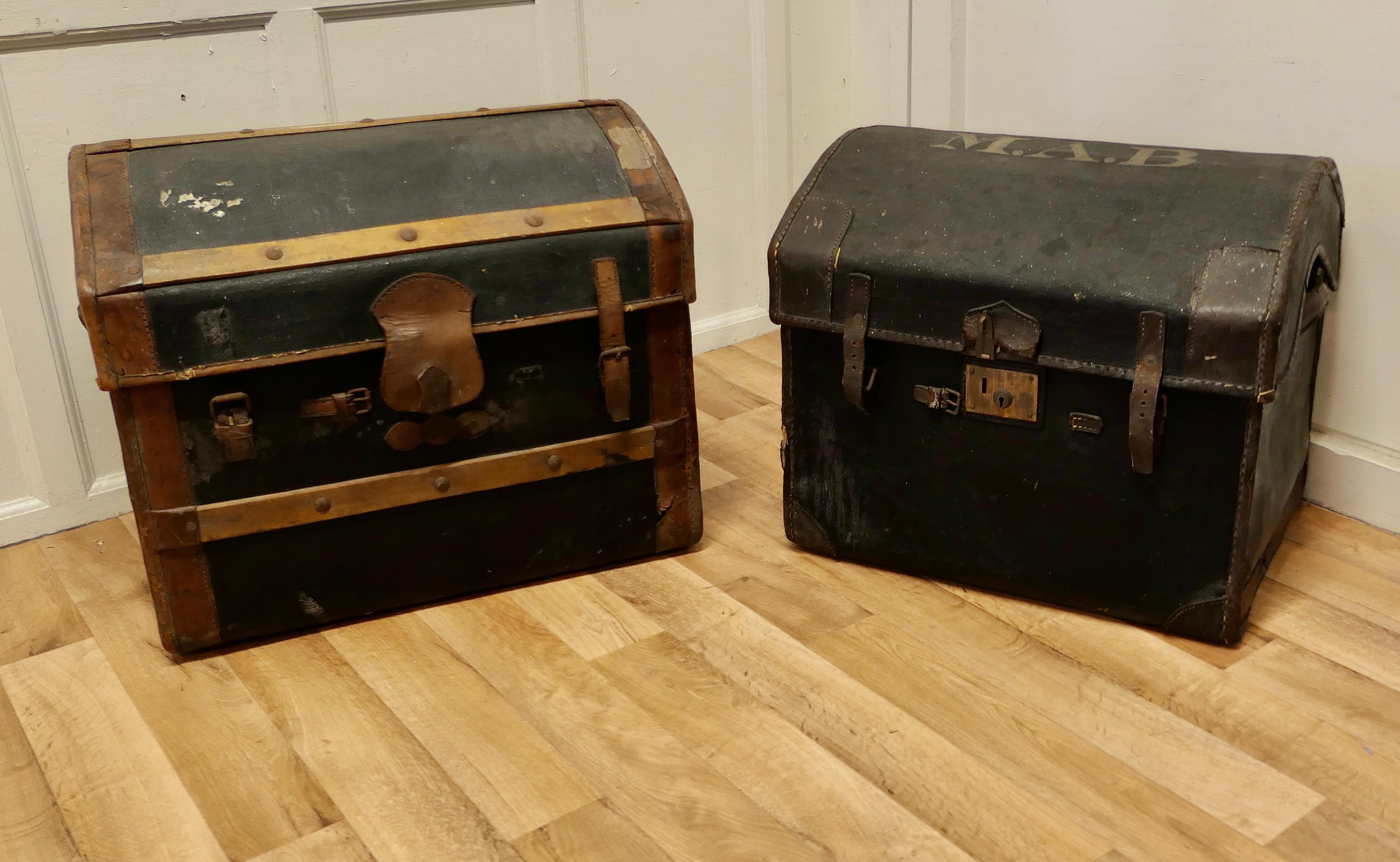 A pair of Victorian canvas and leather dome top travel trunks

The trunks are both lined and made in wicker they are covered with canvas and leather. Both trunks have a dome top shape, leather carrying handles and are stamped with the initials of
