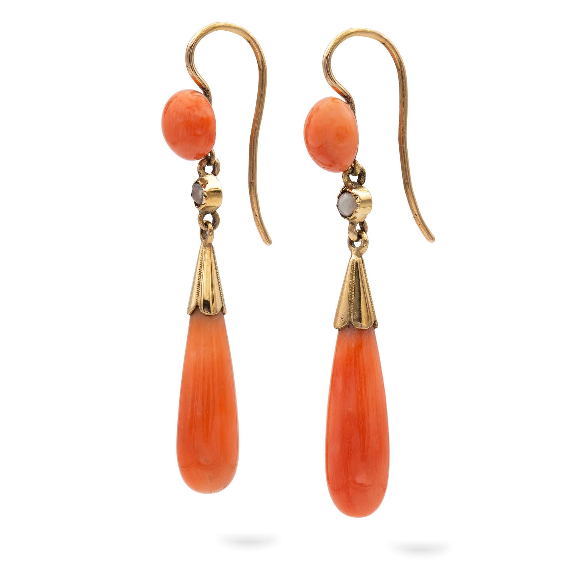 A pair of Victorian coral and pearl drop earrings, each consisted of a button-shaped coral top suspending a pearl and a drop-shaped coral, all mounted in yellow gold, with shepherd-hook  fittings, circa 1890, measuring approximately 4.7cm long, 