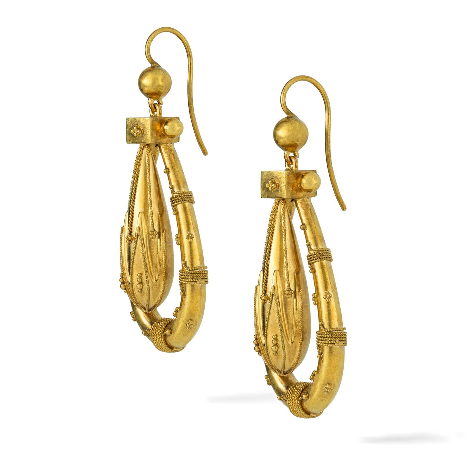 A pair of Victorian Etruscan Revival gold drop earrings, each earring consisting of a pendulum drop centre and golden horseshoe frame, all with a granular bead and wire-work decorations, all suspended by a gold spherical top with wire hook fittings,