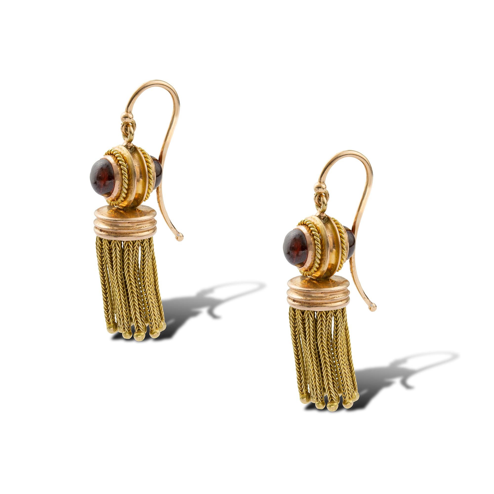 A pair of Victorian garnet and gold tassel earrings, each earring consisting of a sphere set with two cabochon garnets on each side, surrounded by fine twisted gold-rope decoration, suspended by a hook fitting, with chain-tassels suspended from a