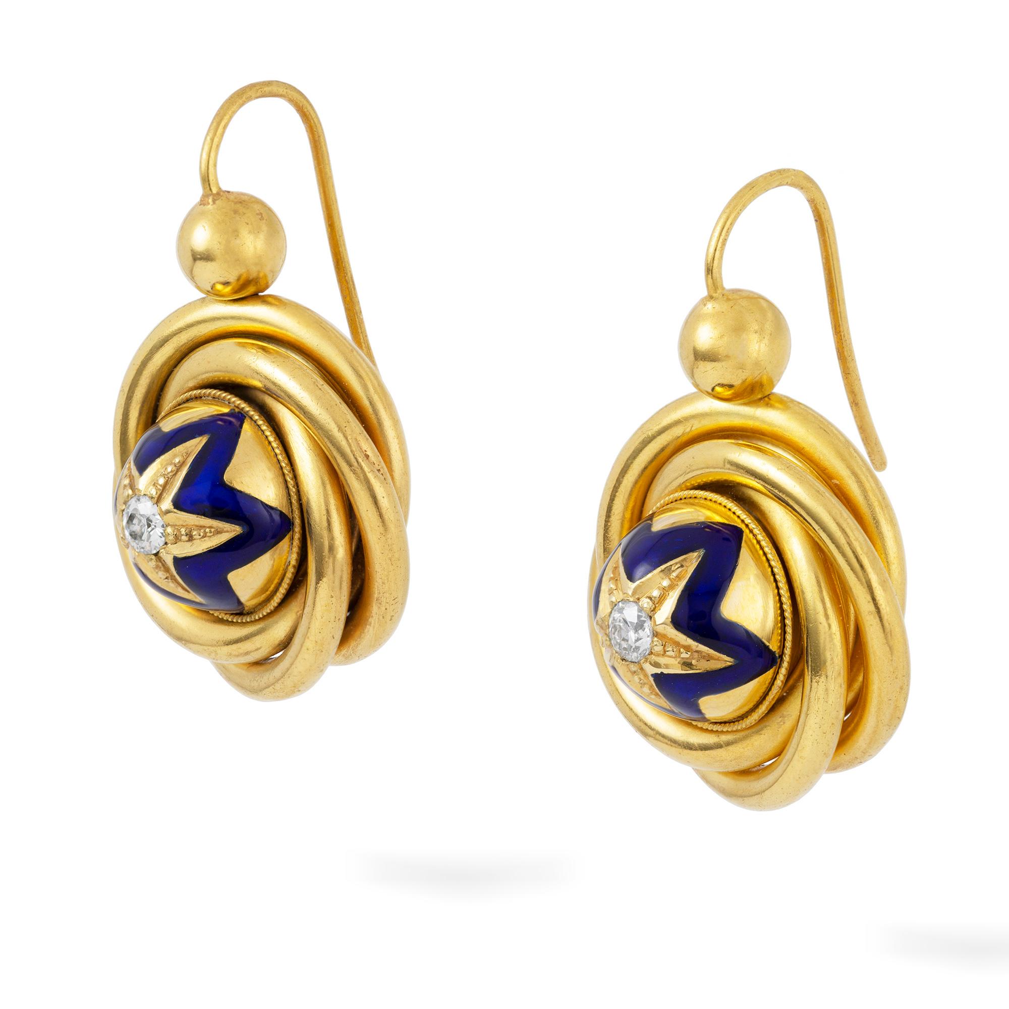 A pair of Victorian gold, diamond and enamel drop earrings, each earring set with an old cut diamond to the centre of a gold and blue enamelled star, surrounded by gold frame and suspended  by gold hook fittings, the diamonds estimated to weigh a