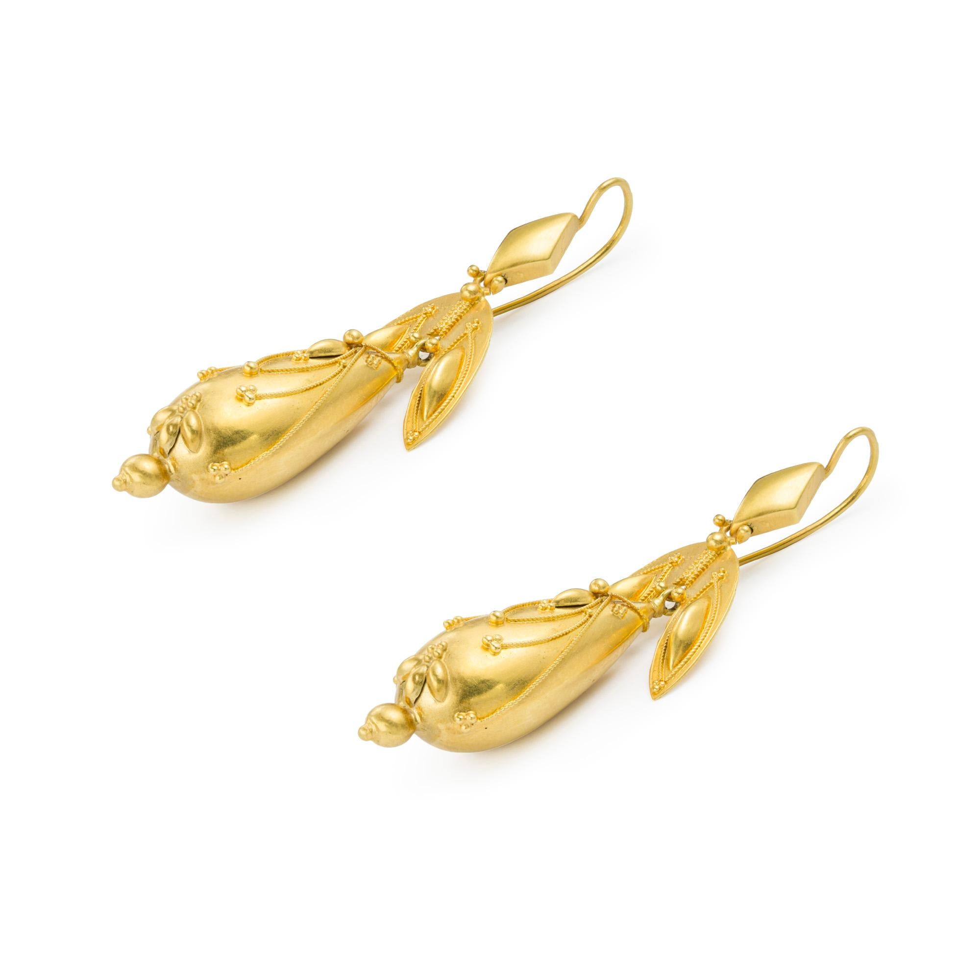 A pair of Victorian gold drop earrings, each earring with a rhomboid-shaped top, suspending a double-leaf design link with twisted wirework and beading decoration, with a pendulum drop with twisted wirework and beading decorations, all made in