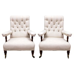 A Pair of Victorian Howard and Sons Open Armchairs, Circa 1900