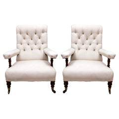 A Pair of Victorian Howard and Sons Open Armchairs, Circa 1900