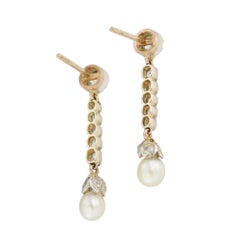 A pair of Victorian natural pearl and diamond drop earrings