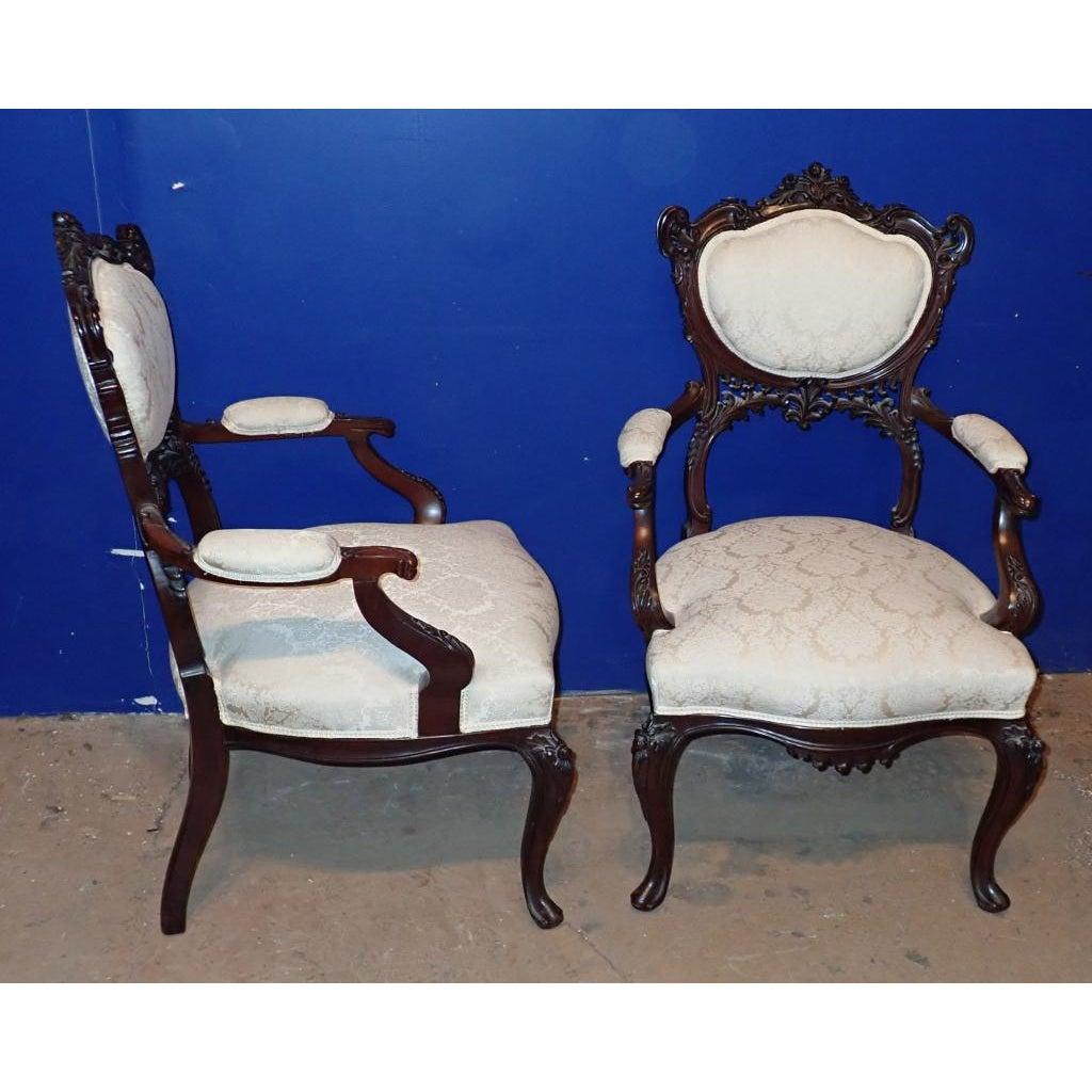 Rococo Revival A pair of Victorian Rococo Carved Arm Chairs