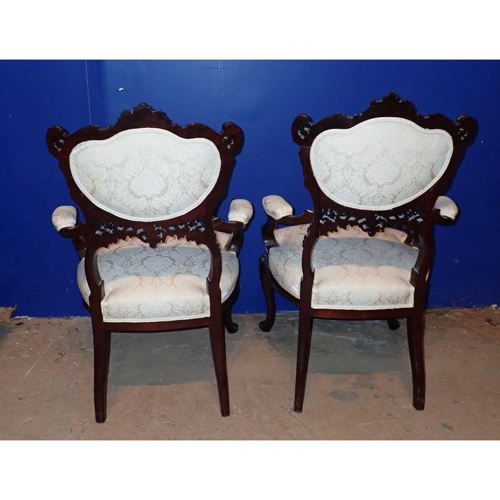American A pair of Victorian Rococo Carved Arm Chairs