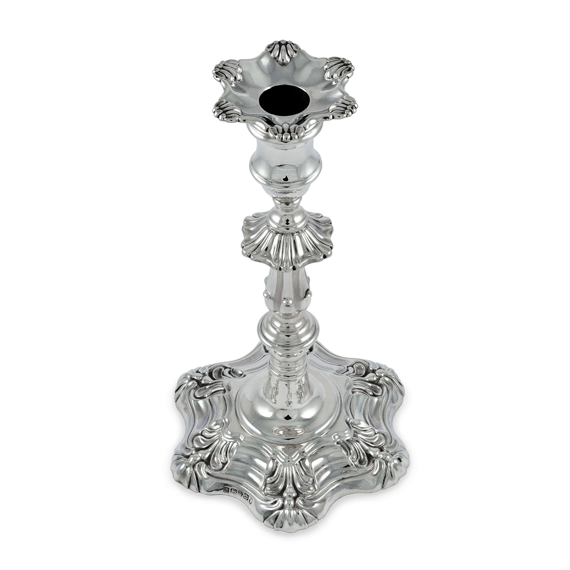 A pair of Victorian sterling silver loaded candlesticks, having decorative baluster stems, with a six-scroll pattern base and detachable sconces, maker John Knowles & Son, Sheffield, 1888, height 9