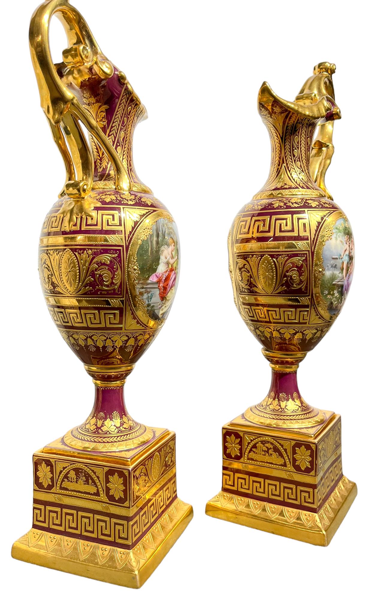 A Pair of Vienna Style Porcelain Iridescent Burgundy Ground Ewers on Stands  In Good Condition In New York, NY