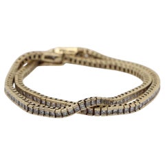 A Pair of Vintage 14K Gold Diamond Bracelets