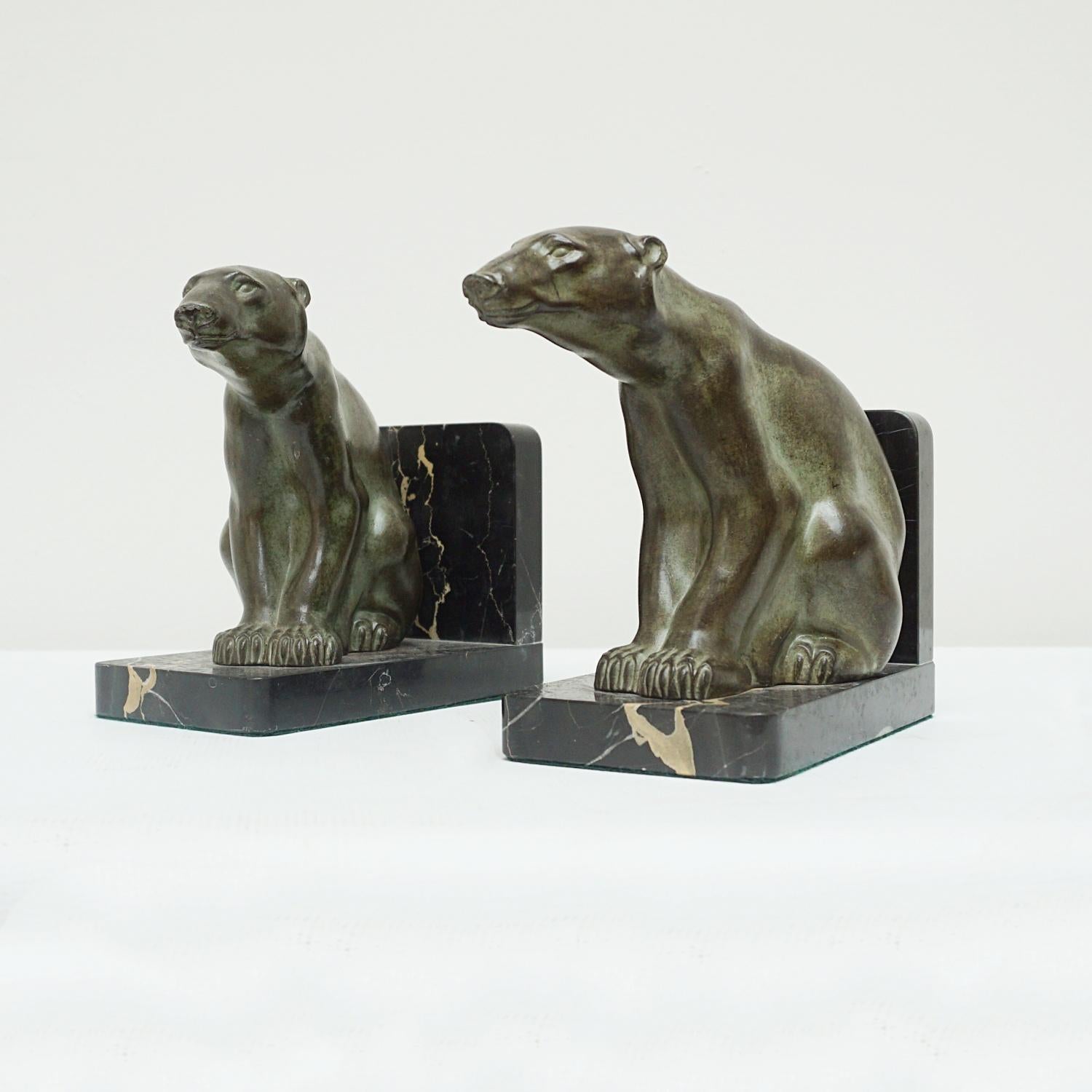 A pair of Art Deco Polar Bear bookends. Two Polar Bears looking outwards seated on marble bases. Spelter and marble. Signed M. Font to back of Polar Bear. 

Dimensions: 16cm W 9cm D 6.5cm

Origin: French

Date: Circa 1930

Item Number: