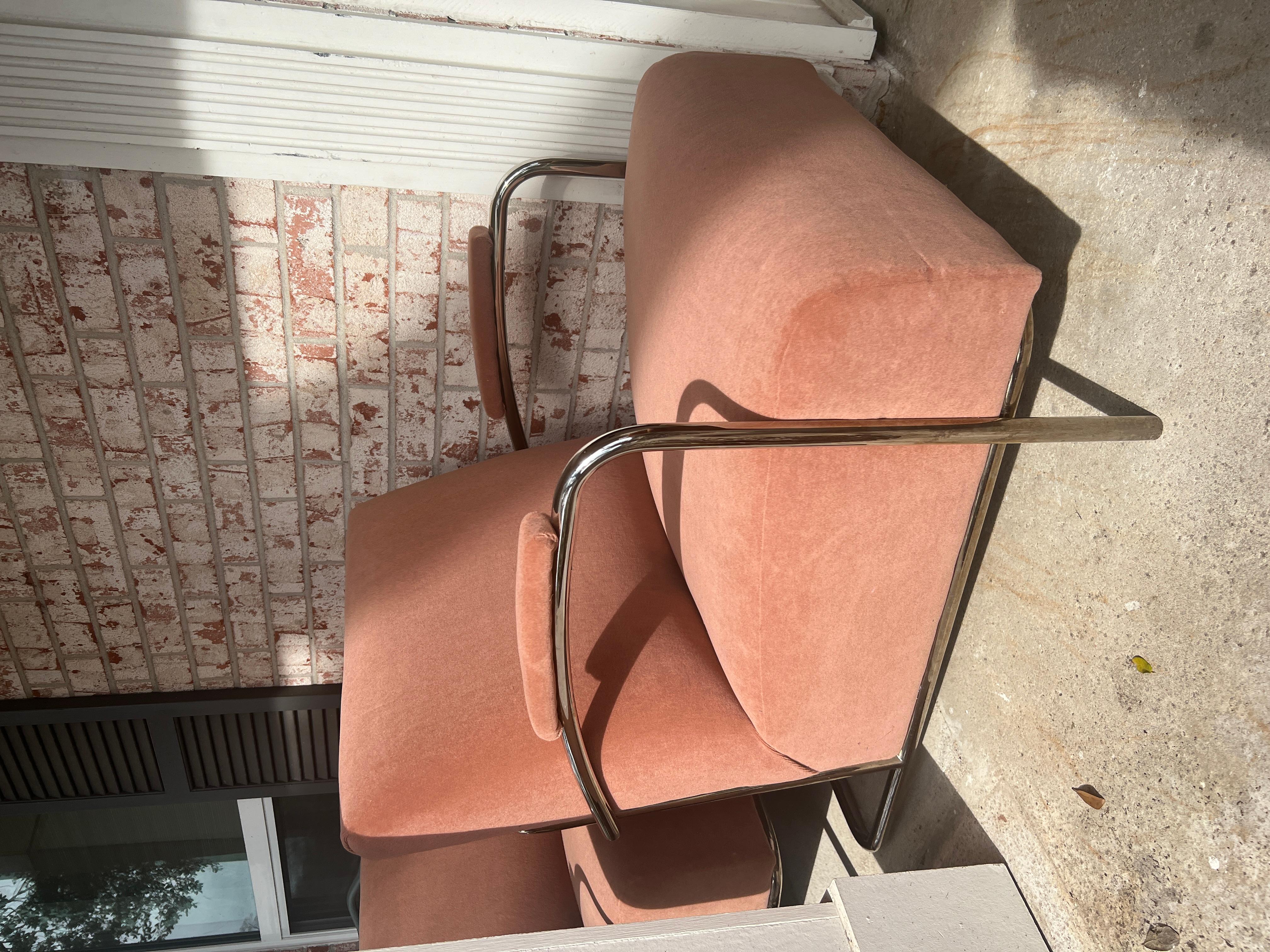 A pair of tubular Louis Sognot style lounge chairs reupholstered in a dusty rose mohair. Louis Sognot was among the most influential designers and his work is noted for its Modernist design, using clean lines and polished chromed metal to create