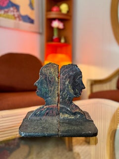 A pair of vintage Brutalist woman man face book ends