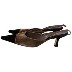 A pair of Vintage Chanel olive green and black Velvet Kitten Heels in size 39, 6