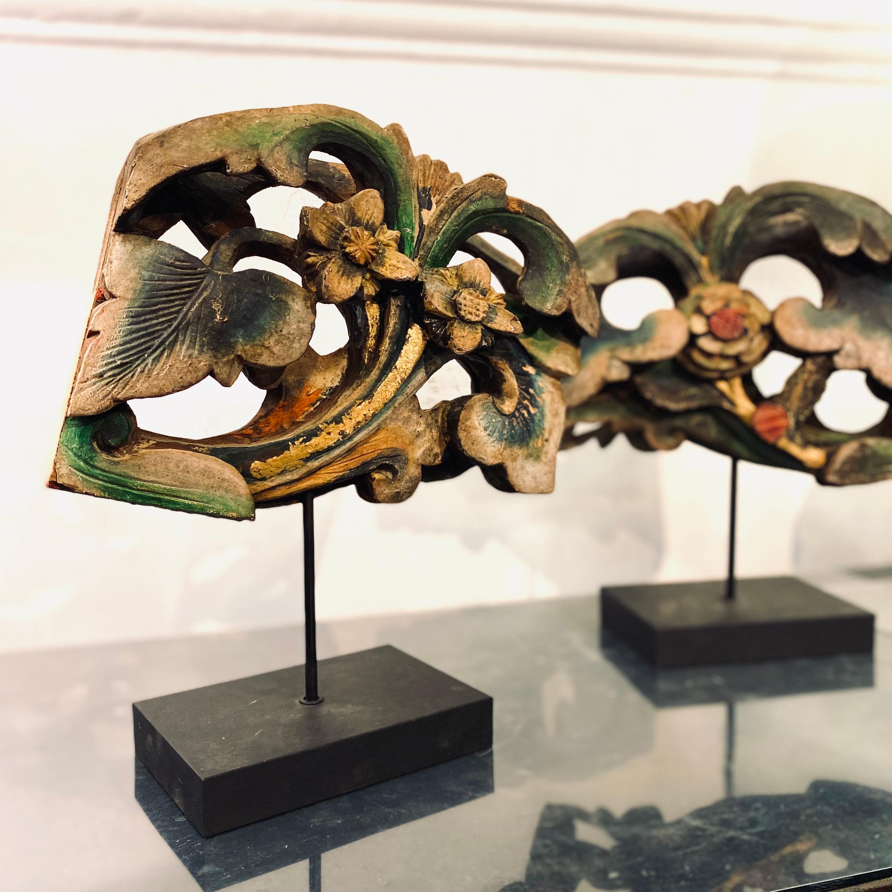 A pair of wood carvings with beautiful original colour from Fujian province. These used to parts of pillar or column decorations, but as most of the column was damaged, these were salvaged and put on new stands to become display pieces. The original