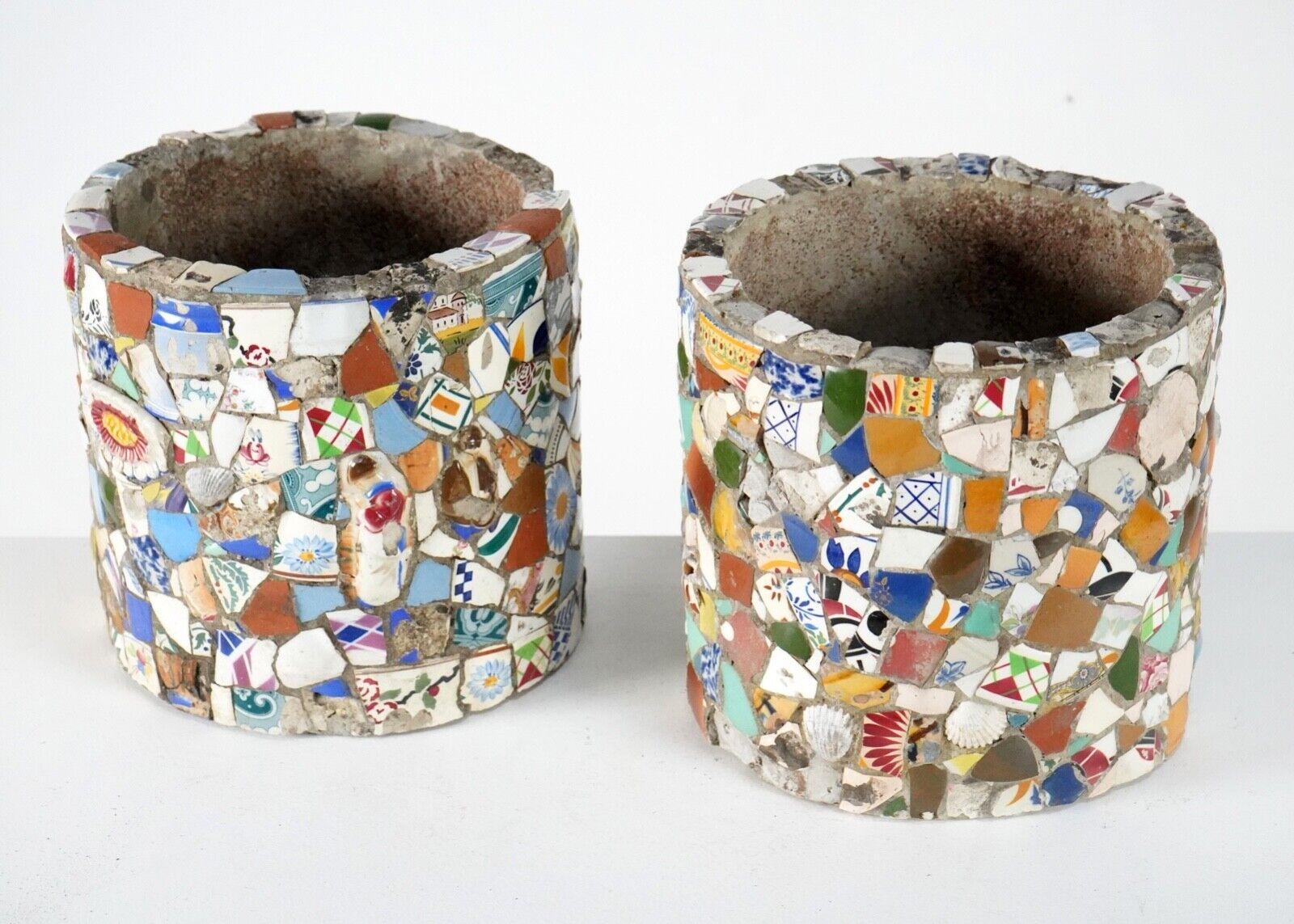  great pair of French Folk Art pique assiette mosaic plant pots.
 A vibrant duo which is decorated with miscellaneous & colourful pieces of pottery. These trencadis (broken up pottery) planters are heavy and large in size and believed to be circa