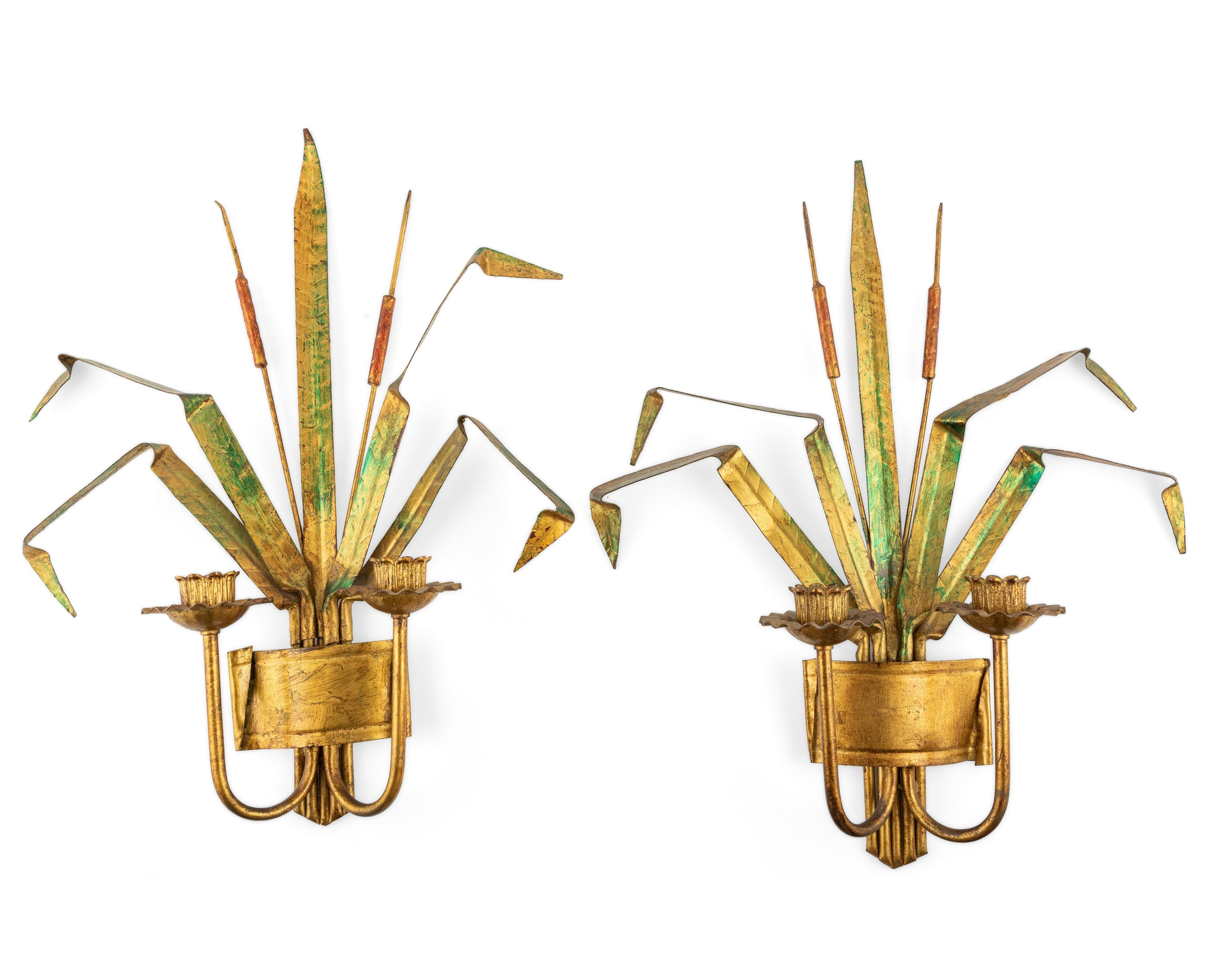 A pair of vintage gilt metal wheat form sconces. A vintage pair of wheat motif gilt and painted metal double arm wall sconces.  The pair of wall sconces with two light feature a sheaf of painted  leaves in gilt and green tones with bent wheat leaves