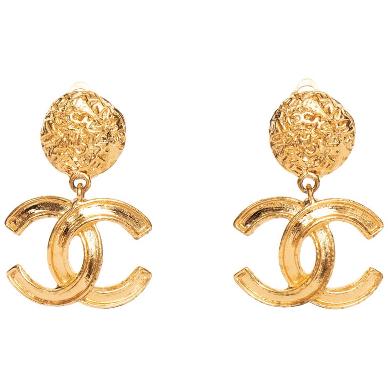 A Pair of Vintage Gold-Toned Chanel '95 Logo Dangle Clip-On Earrings at ...