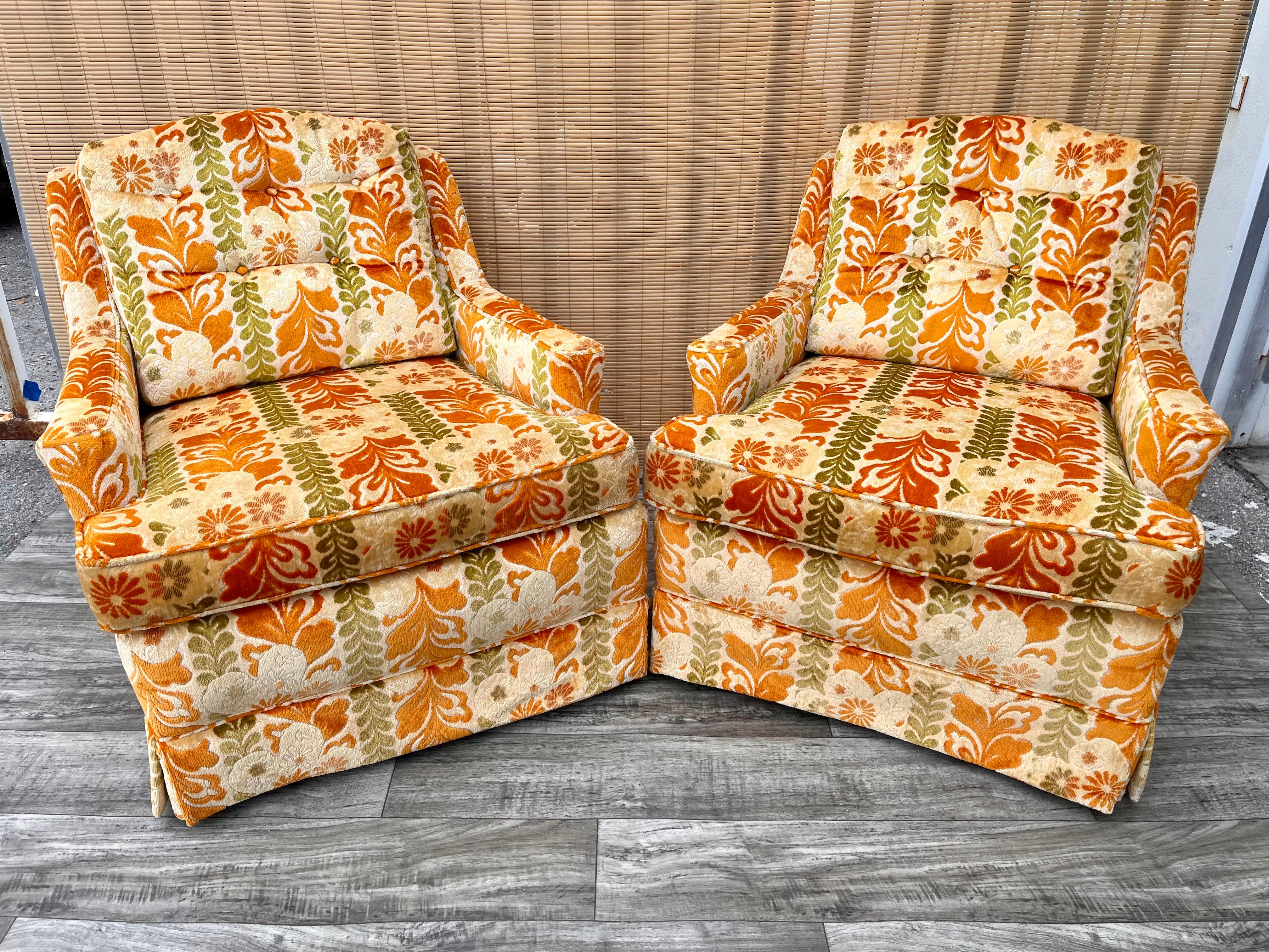 A Pair of Vintage Mid Century Modern / Hollywood Regency Upholstered Lounge Chairs by Highland House of Hickory. Circa 1960s 
Feature the original velvet earth tones floral upholstery, Mid Century Modern tapered legs, and Removable seat and back