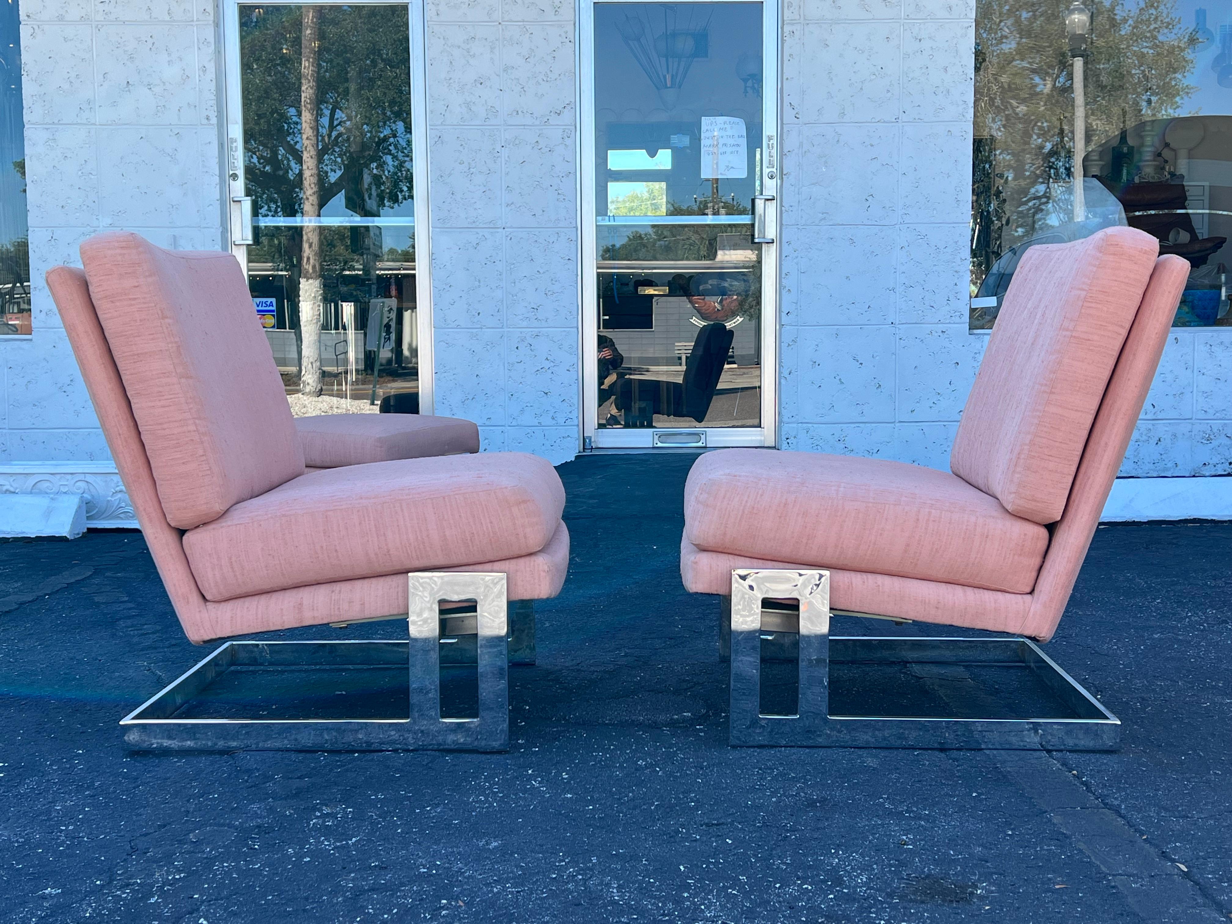 A pair of Milo Baughman slipper chairs with a matching ottoman from original owners, ca' 1984. These cantilevered chairs also have a up/down tilt. Original upholstery.