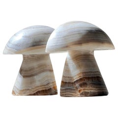 A pair of vintage onyx mushroom bookends, mid 20th century