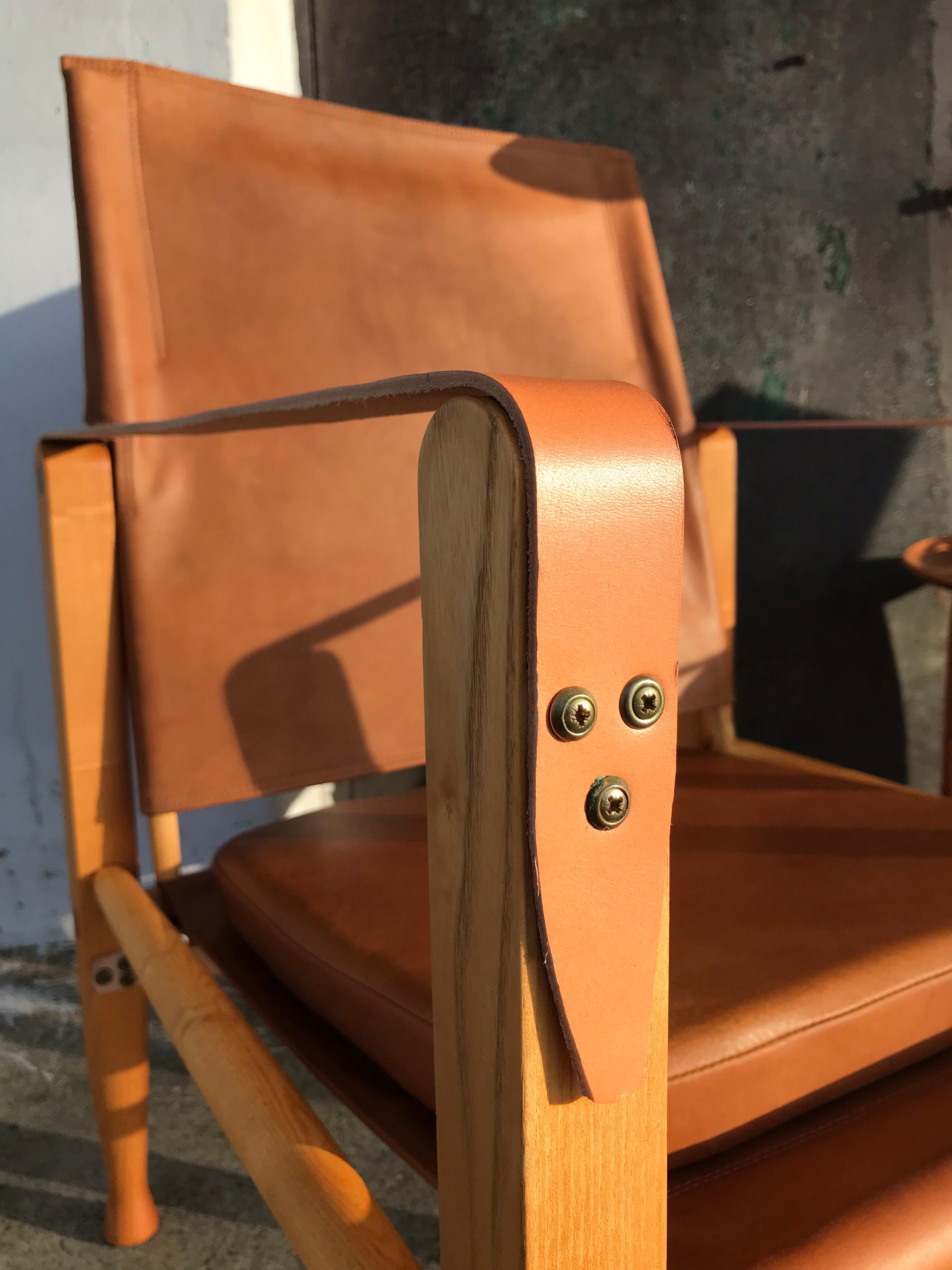 A pair of vintage refurbished safari chairs designed by Kaare Klint for Rud Rasmussen furniture makers.
Kaare Klint designed the safari chairs in 1933.
These iconic chairs are made of ash and have been professionally refurbished with new anilin
