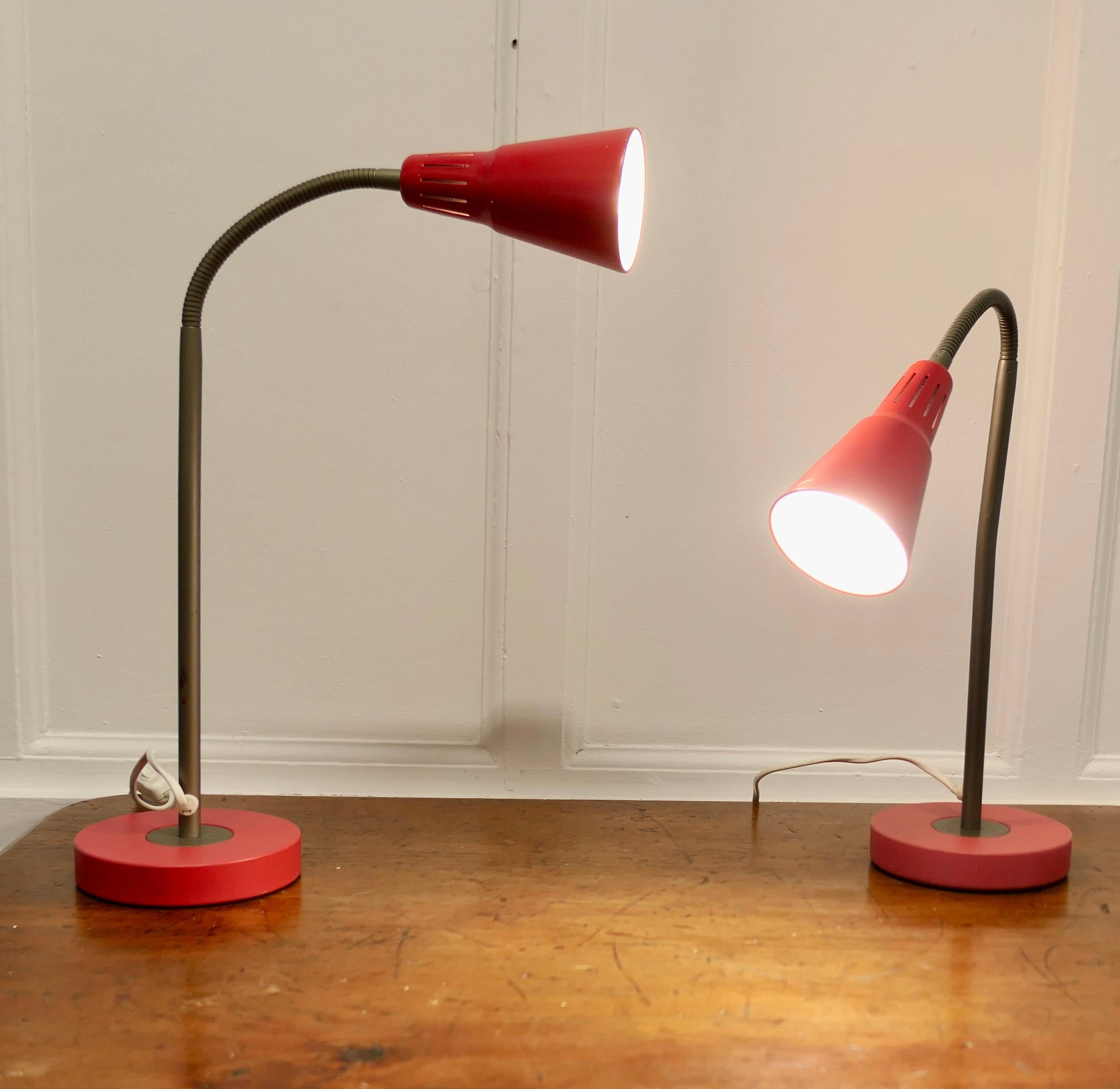 A Pair of Vintage Retro French Angle Desk Lamps

Very stylish statement pieces in red, with a conical shades set on bendy arms which can be angled a little to suit 
The lamps are 26” tall maximum and 6” in diameter
MS98.