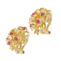 A pair of vintage ruby and gold ribbon cluster earrings