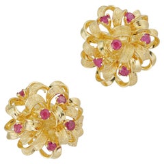 A pair of vintage ruby and gold ribbon cluster earrings