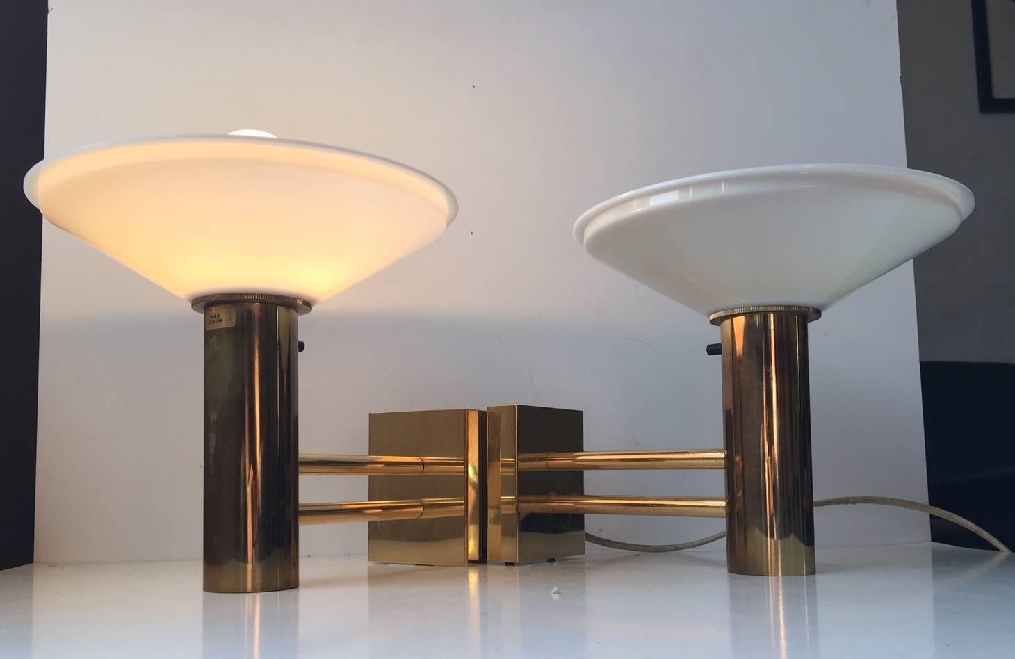 A pair of 1960s nautical - navy sconces composed of brass and mounted with acrylic fluorescent shades. These lights comes from a Norwegian Navy Ship (No: sjøforsvaret). The HV initials within a crown labeled to the base of each light indicate this
