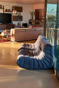A pair of vintage Togo lounge chairs in periwinkle corduroy, 20th century