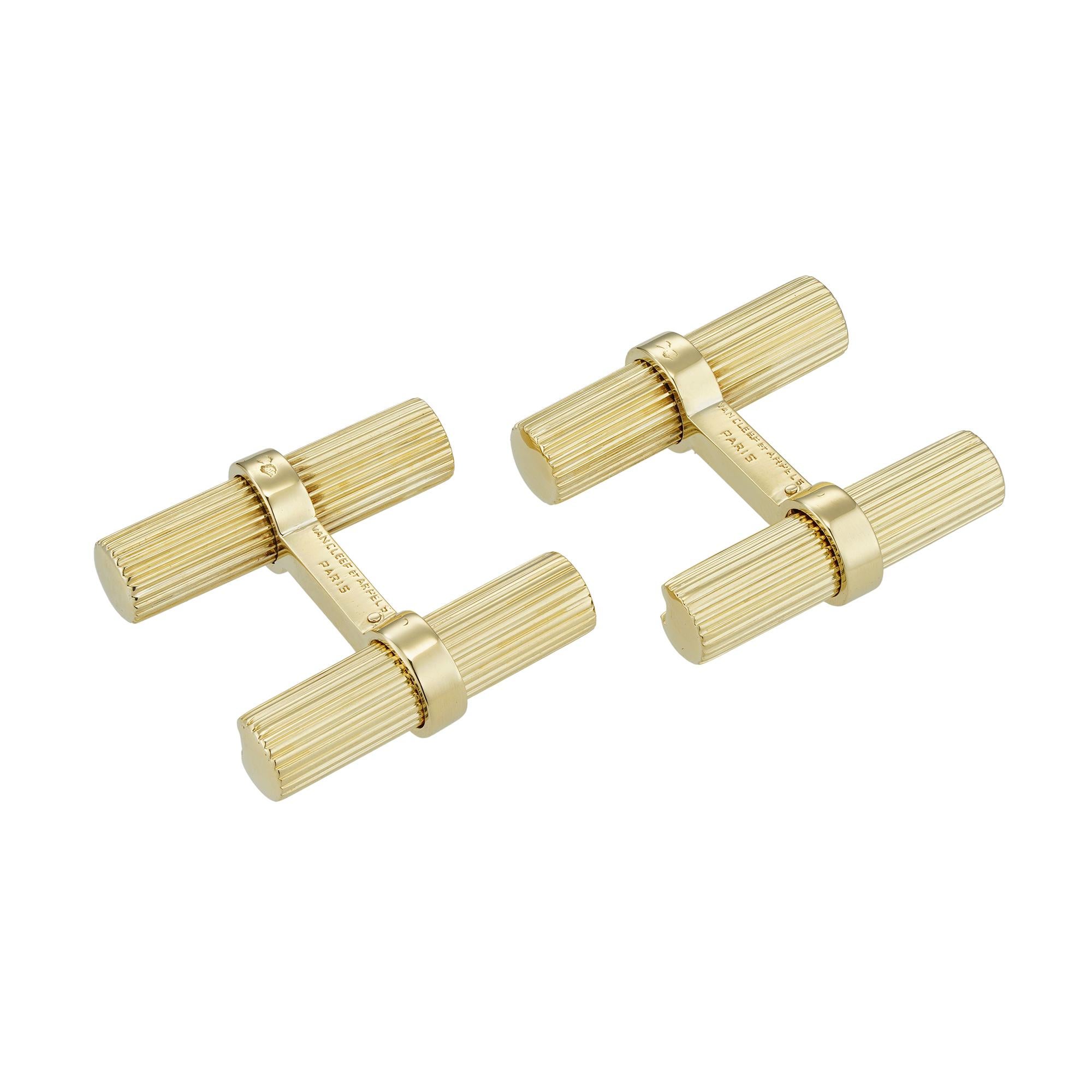 A pair of vintage VCA gold cufflinks, each cufflink consisted of two ridged  yellow gold batons, connected by bar, one of the batons with sliding mechanism, signed “Van Cleef et Arpels Paris”, inventory number 73693, bearing eagle head 18ct gold