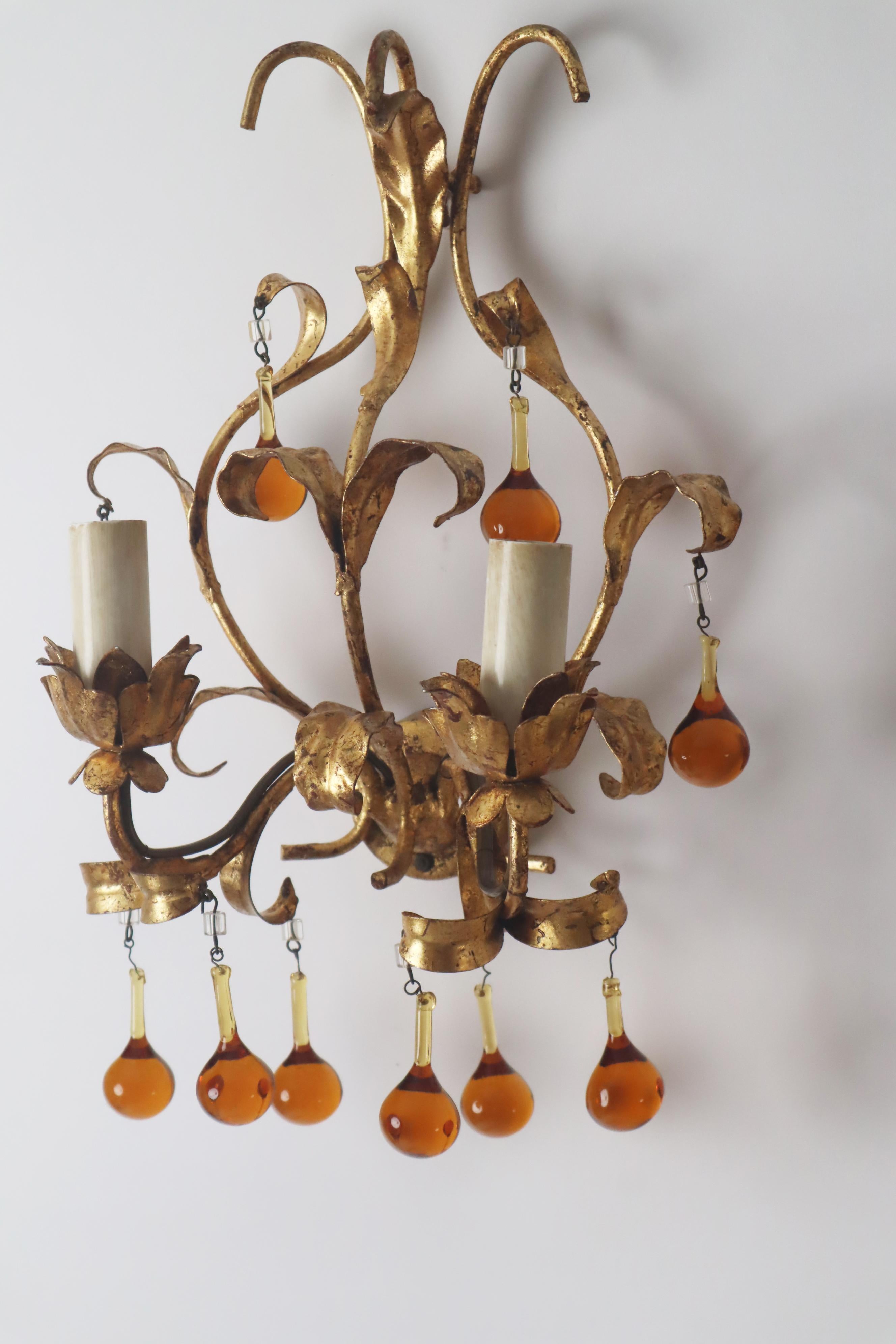 Hollywood Regency A pair of wall lamps with dropping crystal glass. italy, 1960s For Sale
