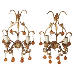 A pair of wall lamps with dropping crystal glass. italy, 1960s