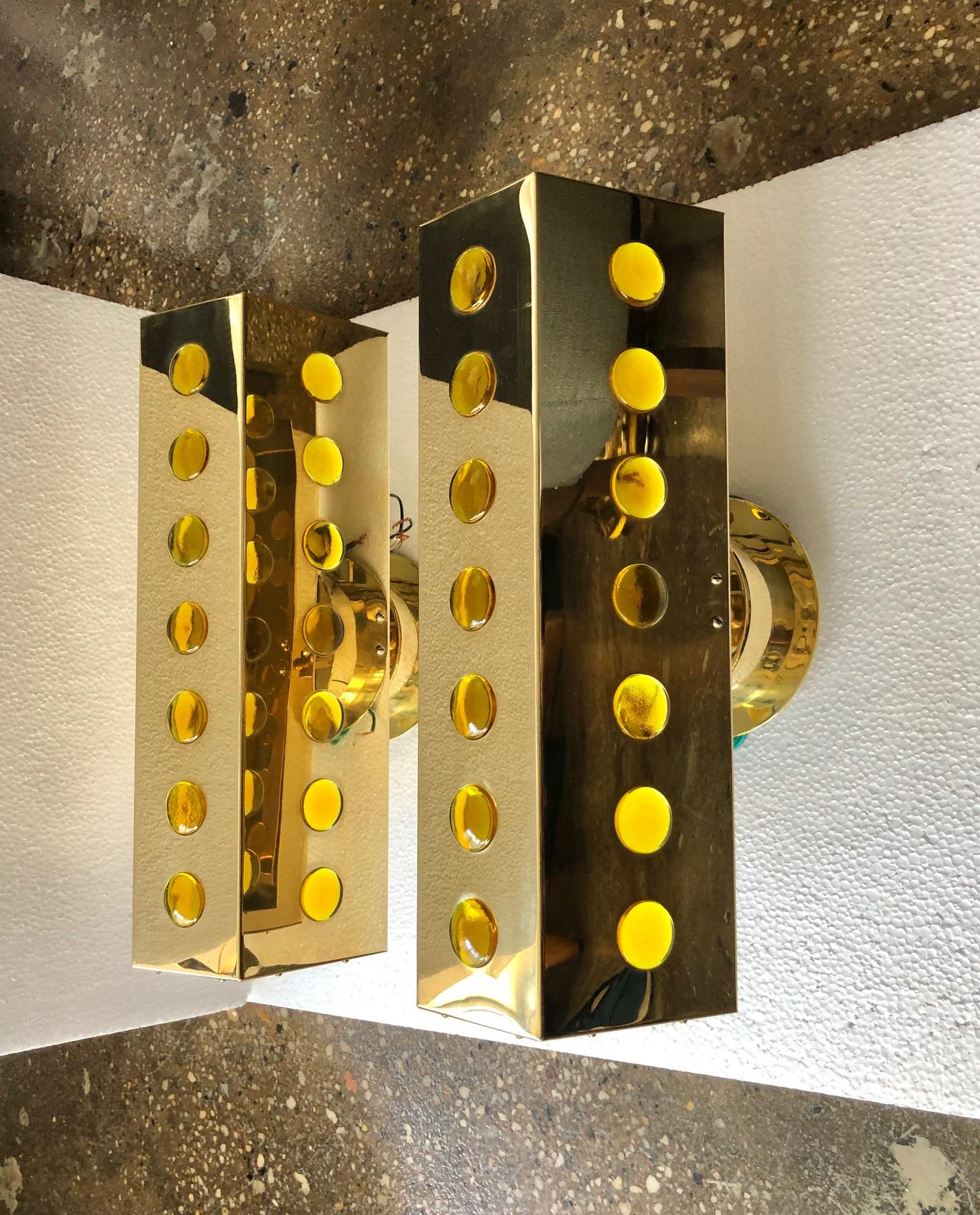 A pair of large wall lights designed by Hans Agne Jakobsson, for Markaryd Sweden , Circa 1970th.
Polished brass with colored glass decoration.
Newly rewired with 2 sockets each and UL listed label. Re-polished an waxed.
Price is for each fixture.