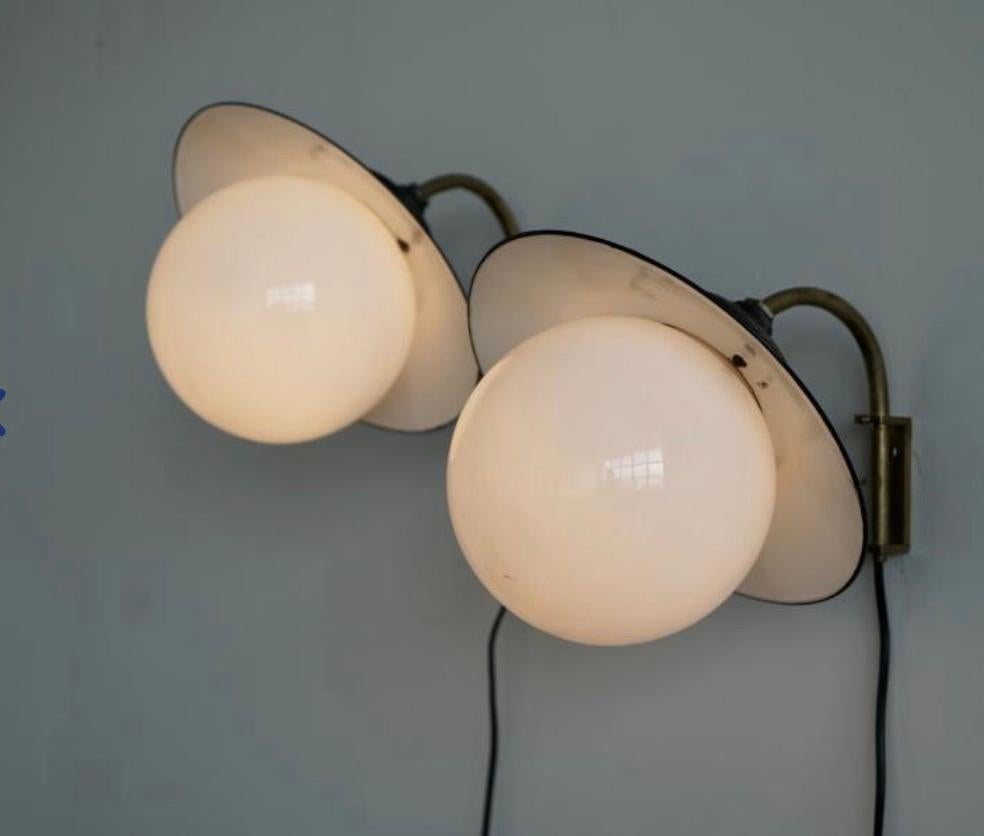 A pair of wall lights by Paavo Tynell for Taito Oy. In Good Condition For Sale In Long Island City, NY