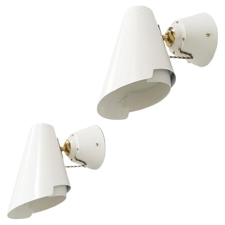 A pair of wall lights by Paavo Tynell, model 2351.