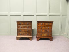 A Pair of Walnut Bedside Chest of Drawers
