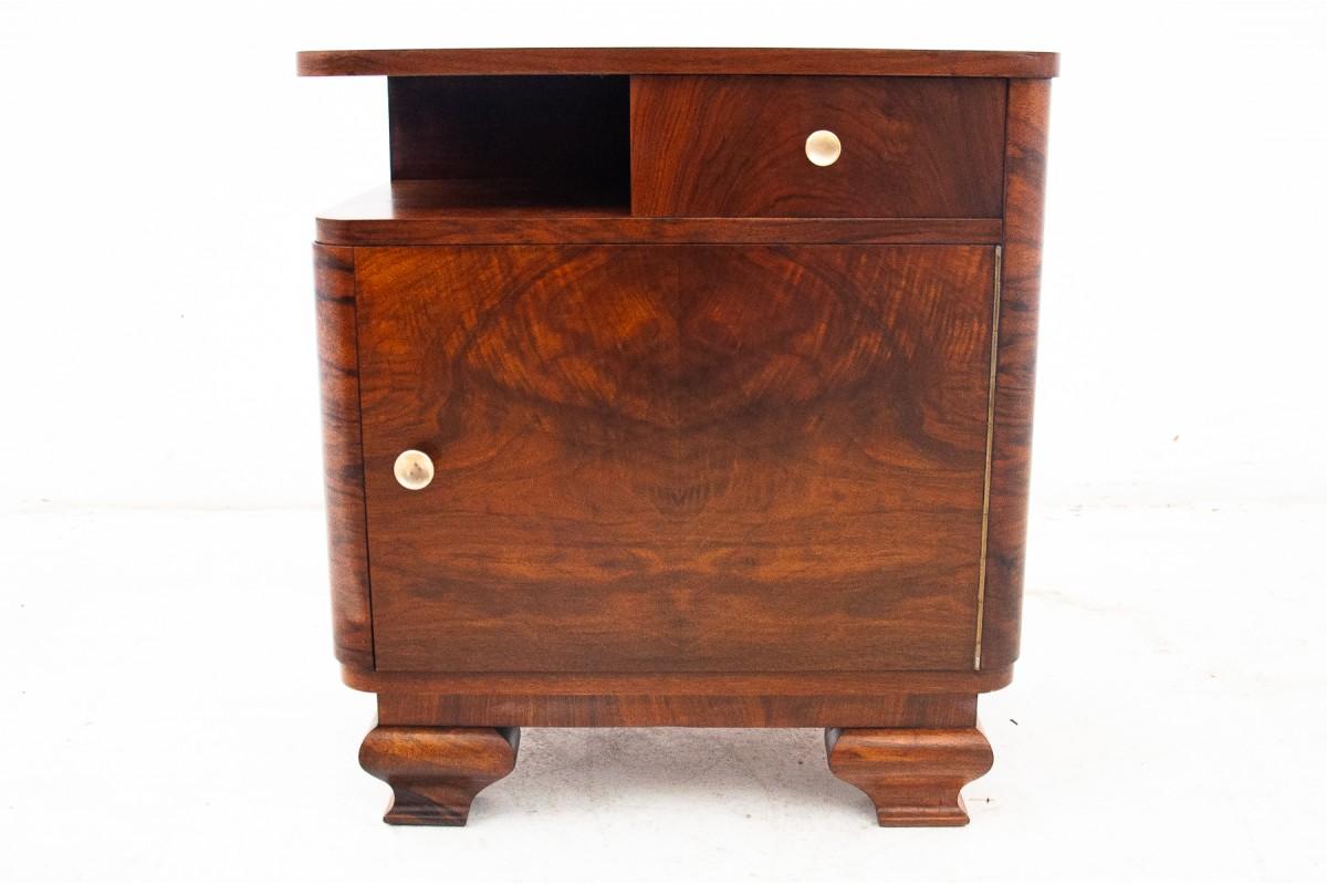 Mid-20th Century A pair of walnut bedside tables, Poland, 1950s.