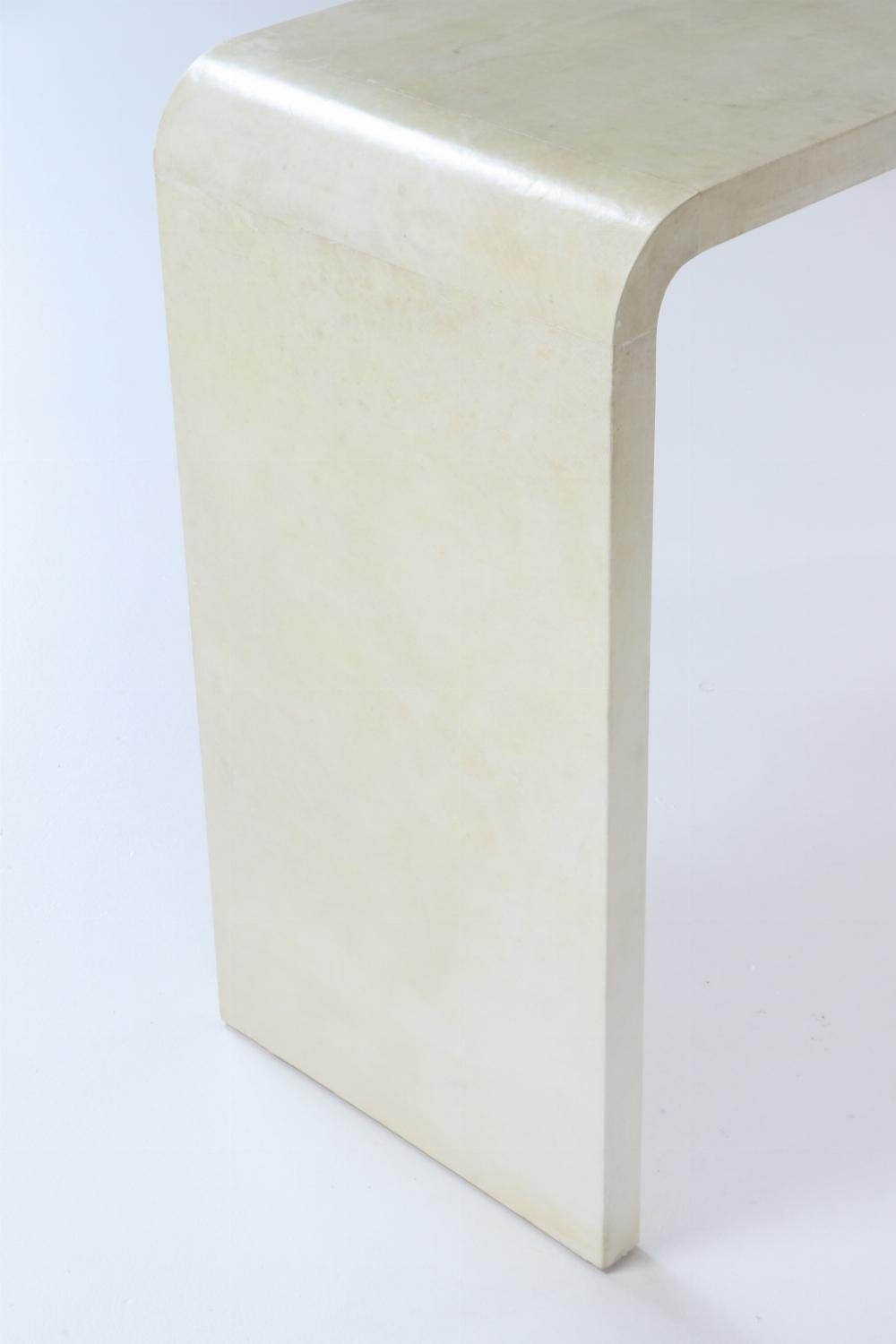 A pair of waterfall console tables in the manner of Jean-Michel Frank. 3