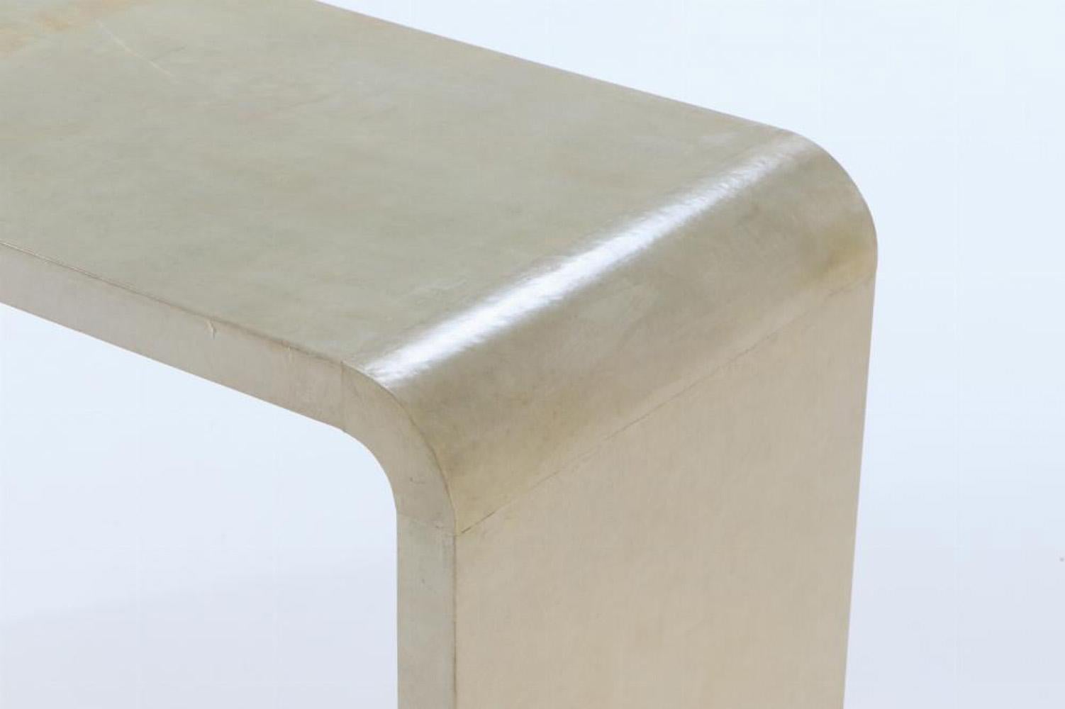 Mid-Century Modern A pair of waterfall console tables in the manner of Jean-Michel Frank.